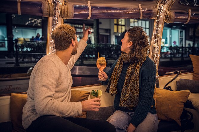 Amsterdam: 1-Hour Canal Cruise in the Evening - Amstel and the bridge-and-gate landmarks that explain how the city formed