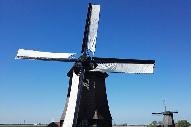 Amsterdam and Countryside Private Full-Day Tour by luxury car - Waterland: dikes, windmills, and villages that slow you down
