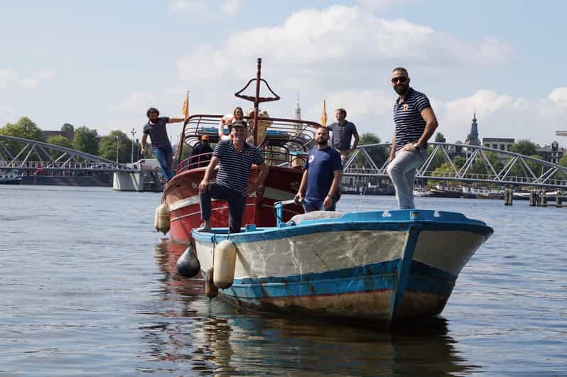 Amsterdam: Canal Cruise on a Wooden Refugee Boat - Key highlights worth your attention
