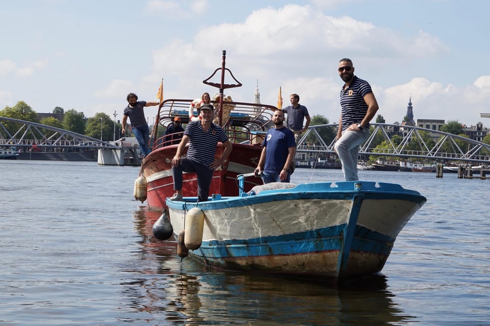 Amsterdam: Canal Cruise on a Wooden Refugee Boat - Comfort, Weather, and What to Bring for Open-Air Canal Cruising