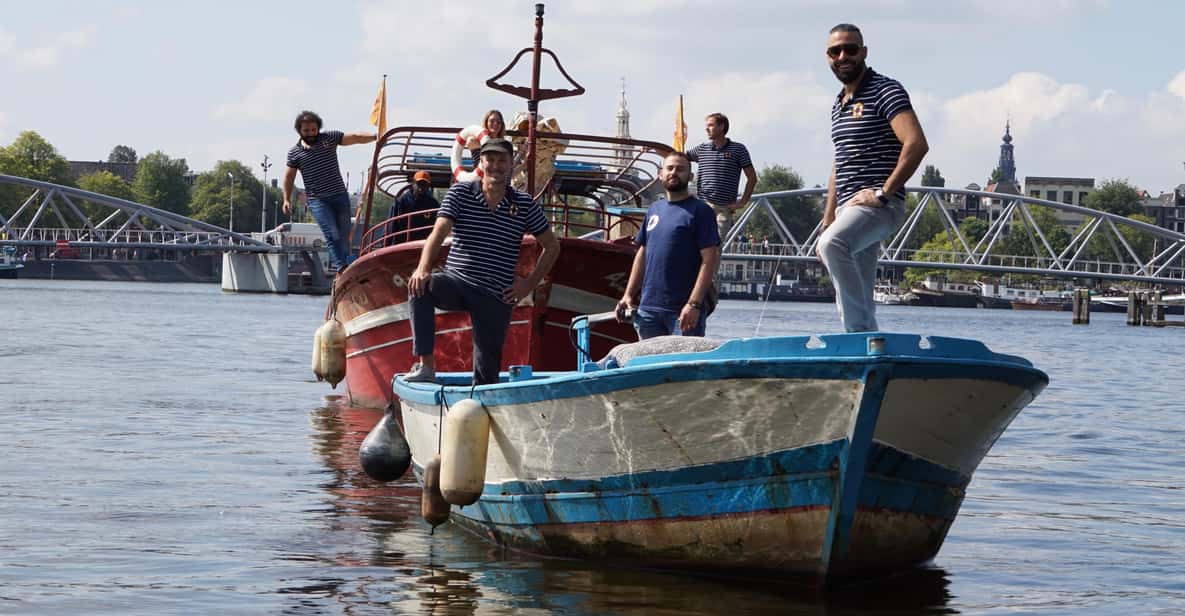Amsterdam: Canal Cruise on a Wooden Refugee Boat - Boarding A Wooden Refugee Boat That Feels Like More Than Transport