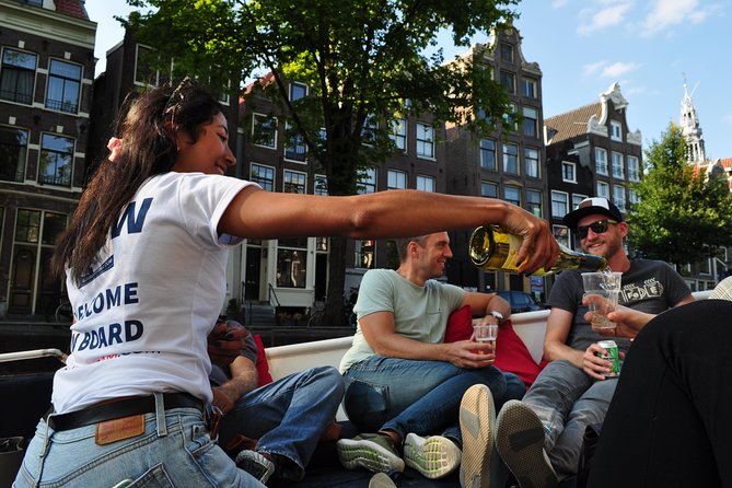 Amsterdam Canal Cruise With Live Guide and Unlimited Drinks - The Canal Route: Hermitage to the Red Light District and the Jordaan
