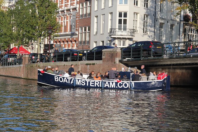 Amsterdam Canal Cruise with Open Bar - Central Station - What You’ll See: Weeping Tower, Magere Brug, and the Golden Bend