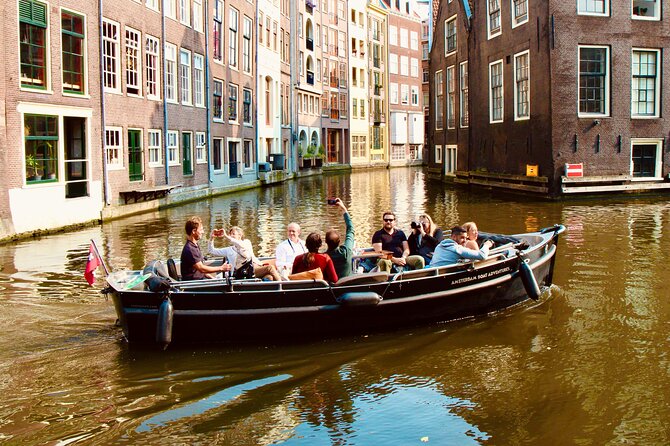 Amsterdam Canal Tour by Open Boat – 90 min Small Group Experience - De Wallen Border Canal: Zuiderkerk, Oudezijds Voorburgwal, And The House On Three Canals