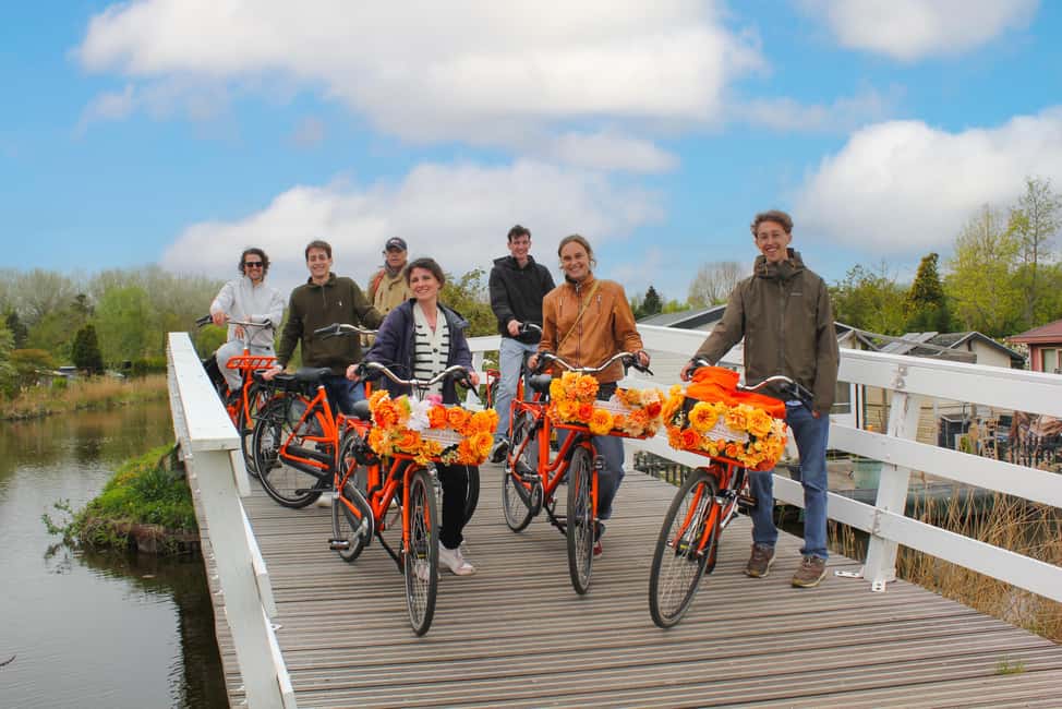 Amsterdam: Cheese, Windmill & Countryside Bike Tour - Biking out along Nieuwendammerdijk: the dike ride that anchors the whole trip