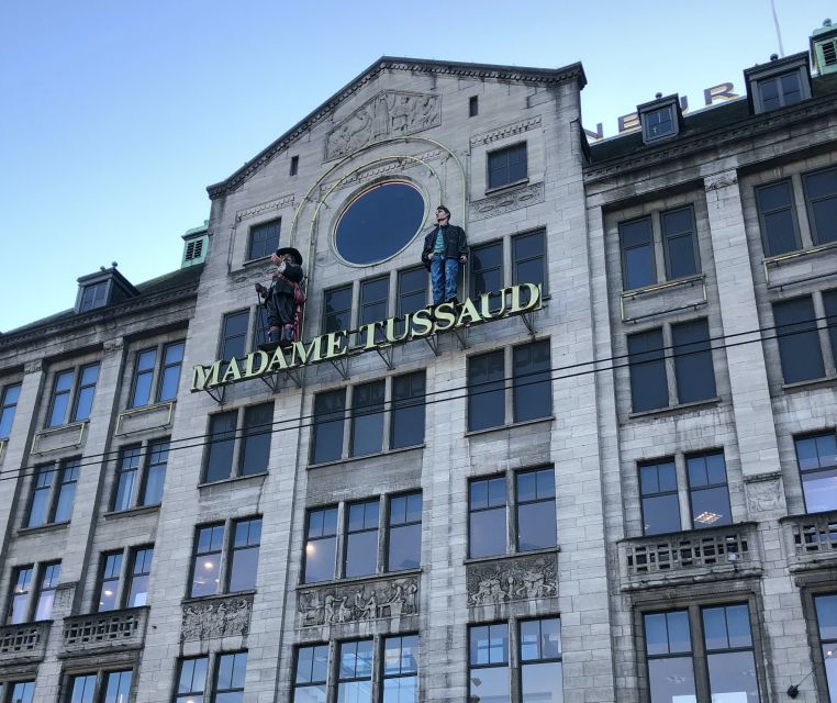 Amsterdam: City Center Walking Tour in italian - Dam Square: your orientation hub, not just a landmark