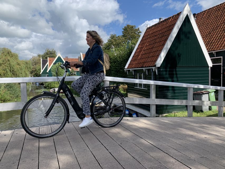 Amsterdam: Countryside Bike Tour and Zaanse Schans Windmills - Monet wetland views and Domineestuin’s wooden houses