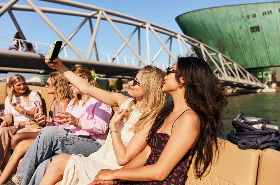 Amsterdam: Cozy Evening Canal Cruise With Open Bar Option - Dam Square to the water: how this cruise starts
