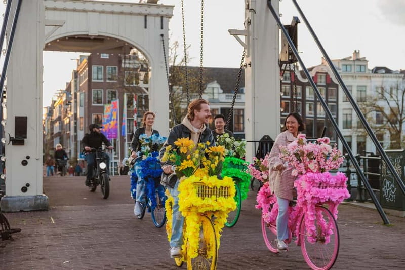 Amsterdam: Explore Canals, Guided Tour on Flower Bikes - The 1.5-hour route: Jordaan to Dam Square stop by stop