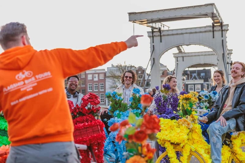 Amsterdam: Explore Canals, Guided Tour on Flower Bikes - Guides matter: orange shirts, humor, and real Q&A time