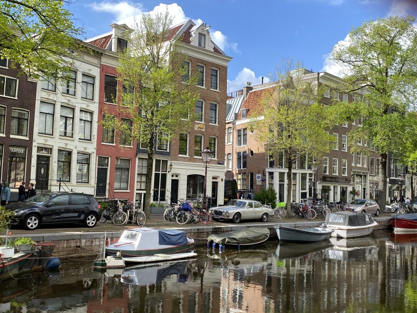 Amsterdam: Guided Off-The-Beaten-Track Walking Tour - Dam Square: Royal Palace, National Monument, and Nieuwe Kerk with meaning