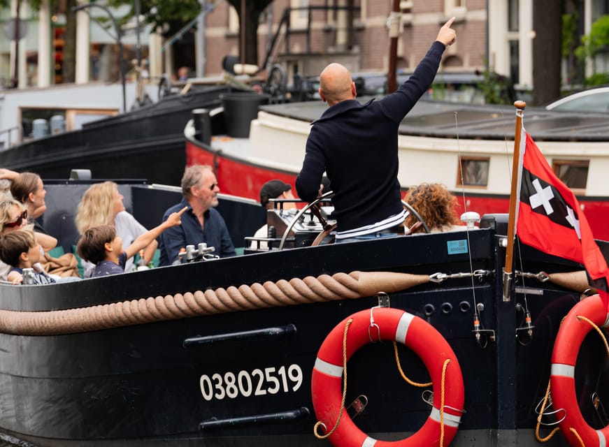 Amsterdam: Guided Open Boat Canal Cruise Including Drink - Who This Cruise Is For (and who might want something else)