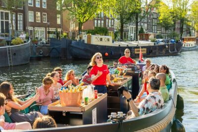 Amsterdam: Guided Open Boat Canal Cruise Unlimited Drinks Option - NEMO and the maritime museum: science and ships from the water
