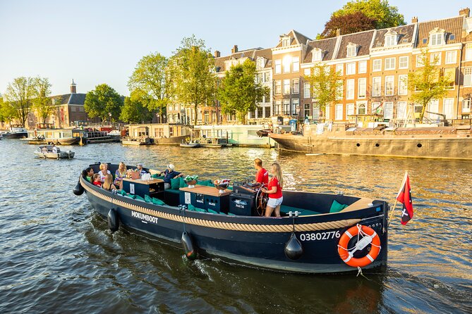Amsterdam: Guided Open Boat Canal Cruise Unlimited Drinks Option - Rembrandt, etchings, and the performing-arts vibe around the canals
