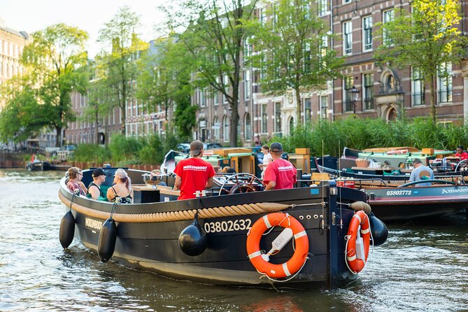 Amsterdam: Guided Open Boat Canal Cruise Unlimited Drinks Option - Canal houses you can feel: Herengracht and the period-room experience