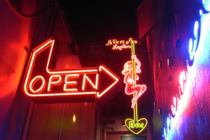 Amsterdam: Guided Red Light District and City Walking Tour - Dam and Amsterdam’s wooden-pole foundations: the city under your feet