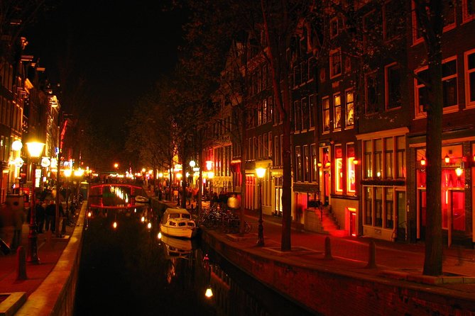 Amsterdam: Guided Red Light District and City Walking Tour - Waag (the old city gate) and guilds: the defensive wall era