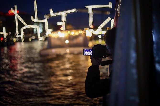 Amsterdam: Light Festival Cruise with Unlimited Drinks Option - Small boat comfort: hearing the guide and surviving the chill