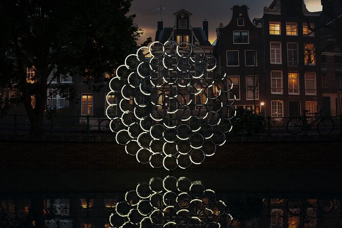 Amsterdam: Light Festival Open Boat - Unl. Drinks Option - Maritime history and the defense tower: the stops that add weight