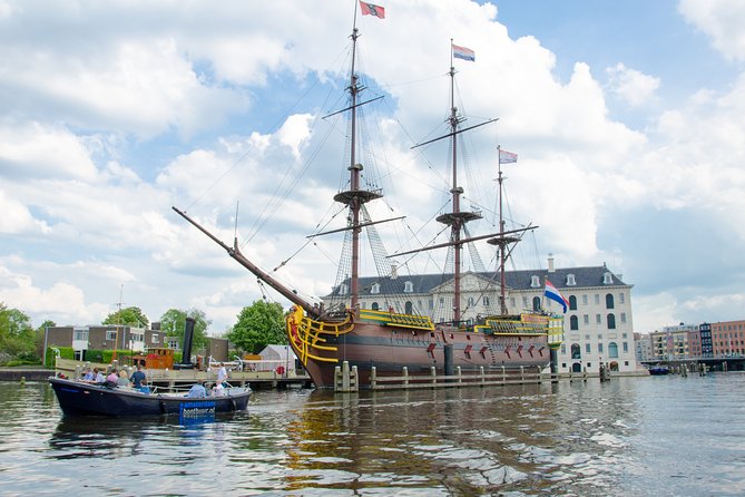 Amsterdam Open Boat Sightseeing Canal Cruise - Captain commentary, sound levels, and how to hear the story