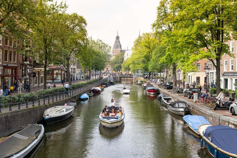 Amsterdam: Open Boat Tour of Canals with Expert Local Guide - Picking your departure: Damrak, Rijksmuseum, or Prins Hendrikkade