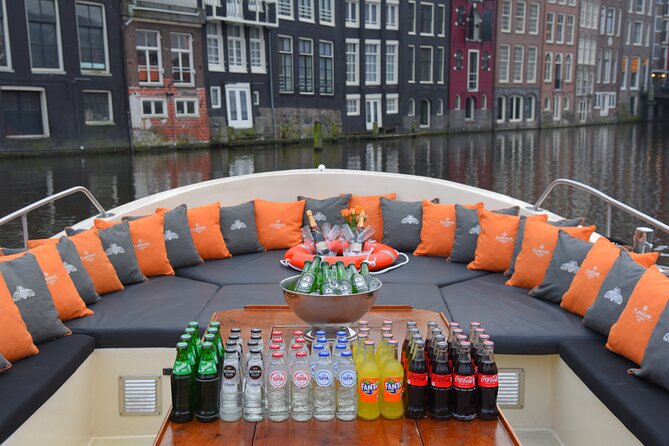 Amsterdam Private BBQ and Drinks Cruise With Onboard Chef - Finishing touches: the train station, medieval Oudeschans tower, and old streets