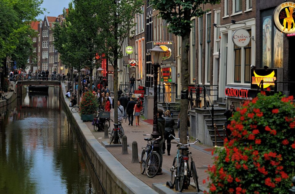 Amsterdam Red Light District tour with a local guide - Zeedijk Street: Sailors, Prostitution Beginnings, and Why the Location Matters