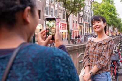 Amsterdam Red Light District Walking Tour in EN/DE/IT/ES - Condomerie facts and why this stops at real-world context