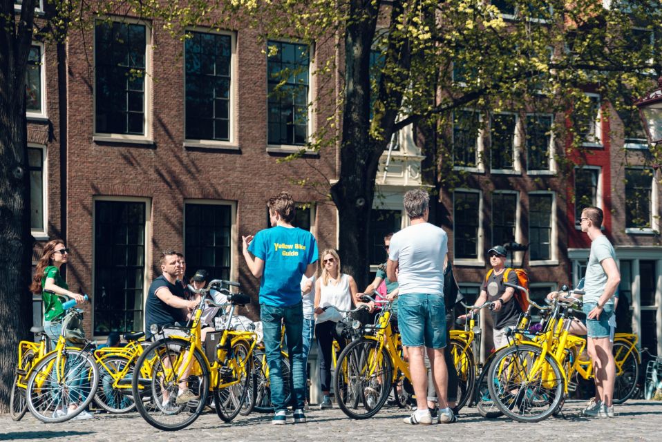 Amsterdam: Relaxed City Highlights Guided Bike Tour - Grachtengordel canals: 17th-century houses and the smallest-house game