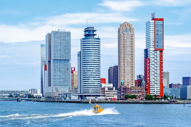 Amsterdam: Rotterdam, Delft and The Hague Private Tour - Delft in one hour plus: canals, churches, and the Delft Blue factory stop
