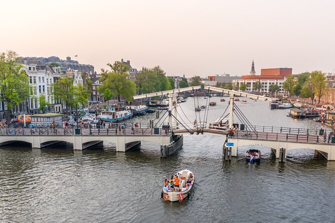 Amsterdam: Saloon Boat Cruise + Unlimited Drinks & Bite option - Weather reality: bring layers, and plan for damp docks