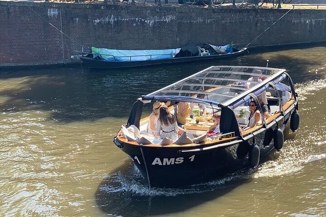 Amsterdam Small-Group Canal Cruise Including Snacks and Drinks - Dutch snacks and drinks: bitterballen, stroopwafels, jenever