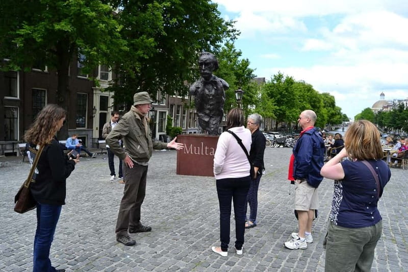 Amsterdam: The Story of History & Culture Walking Tour - The Walk Itself: Historic Centers, Canal Streets, and Smart Photo Stops