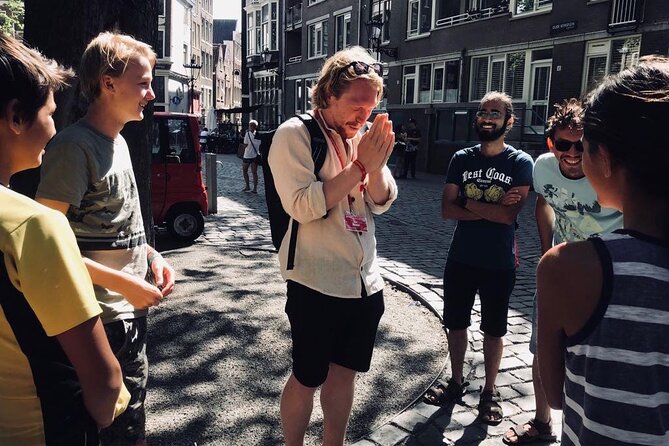 Amsterdam Walking Tour with a local comedian as guide - Grimburgwal Canals: The Dutch Birthday Message Custom