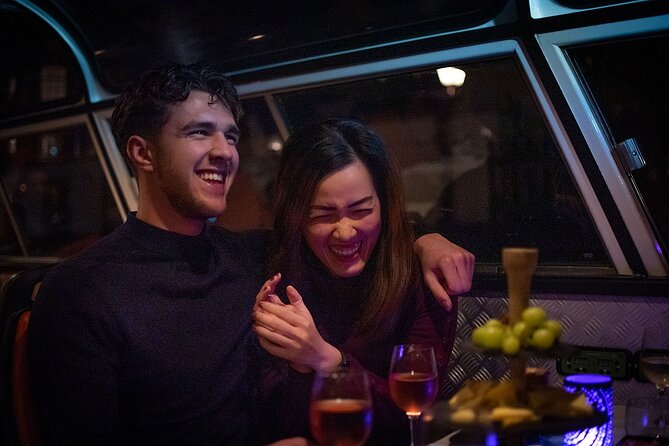 Amsterdam Wine and Cheese Guided Evening Cruise - Stop-by-stop: canals, bridges, and big Amsterdam moments