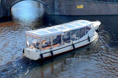 Dutch Cheese & Drinks Guided Amsterdam Boat Tour, All Inclusive - The route’s first chapter: medieval canals and Oude Kerk’s Red Light setting