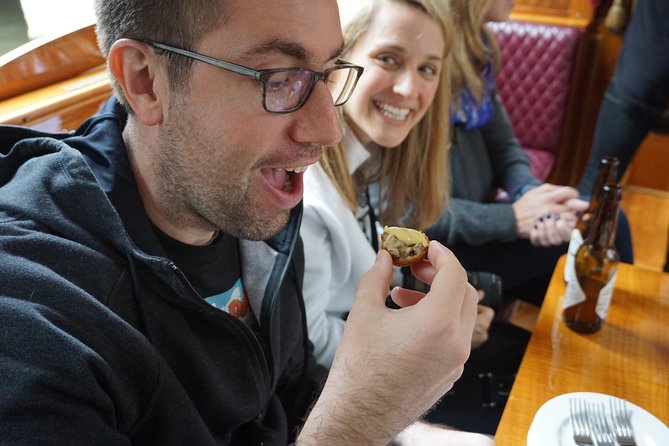 Eating Amsterdam: Food Tour & Canals Cruise - Vishandel Centrum: herring and kibbeling without the tourist fog