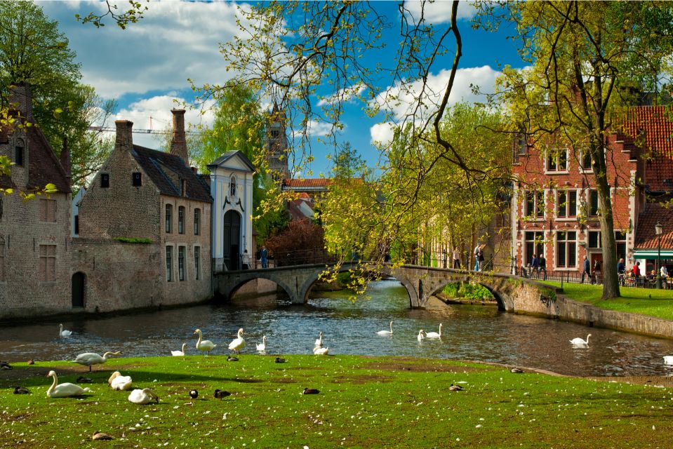 From Amsterdam: Bruges Day Trip in Spanish with Boat Option - Headphones, radios, and what to wear for a smooth day