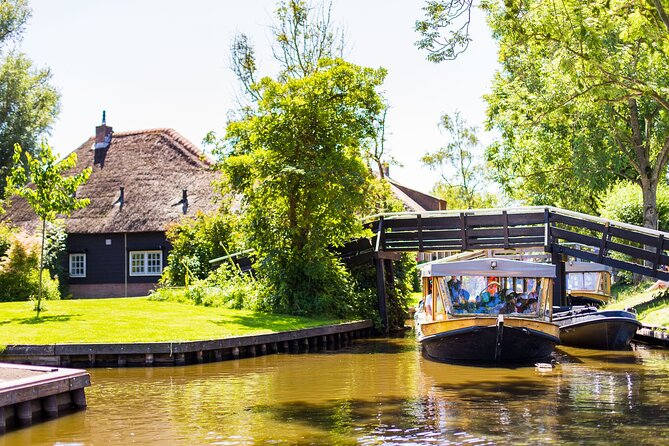 Giethoorn and Afsluitdijk Day Trip from Amsterdam with Boat Trip - From Amsterdam’s pickup to Giethoorn: expect real countryside time