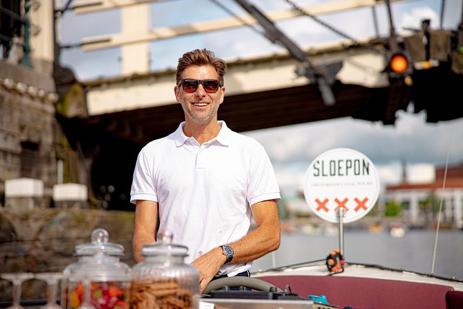 Guided Amsterdam Canal Cruise – Snacks & Drinks on board(1 Hour) - From maritime roots to a ship-shaped showpiece with rooftop views