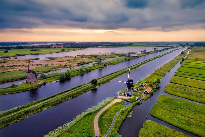Kinderdijk Windmills and Delft Small-Group Tour from Amsterdam - UNESCO Kinderdijk: Working Mills, Water Control, and a Real-View Boat Ride