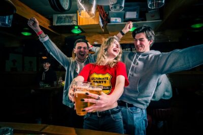 New Year's Eve Pub Crawl With Optional Club Entrance - Dam Square at midnight: the bubbly moment that anchors the night
