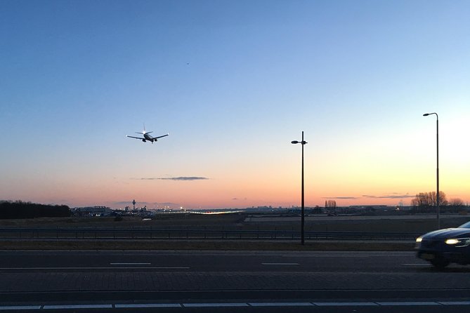 Private departure transfer from Amsterdam to Schiphol Airport (AMS) - Inside the Vehicle: Mobile WiFi, Bottled Water, and a Soft Drink