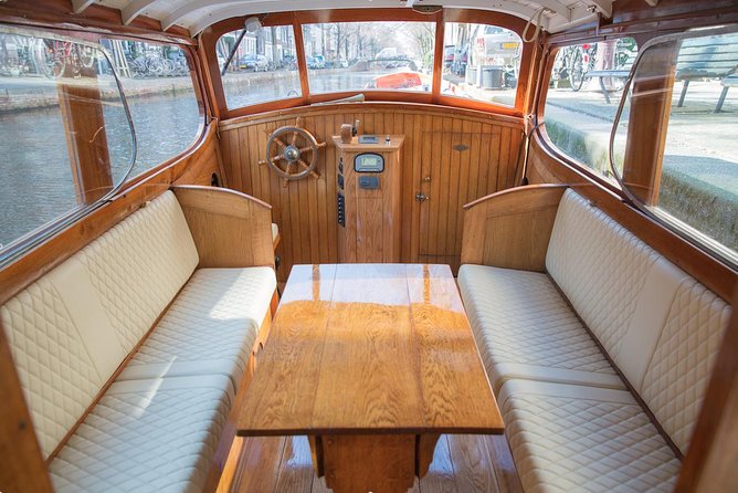 Private Guided Historic Amsterdam Canal Cruise in a Salon Boat - The route style: short stops plus live narration