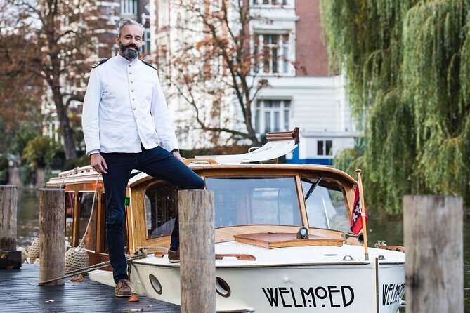 Private Guided Historic Amsterdam Canal Cruise in a Salon Boat - Captains and narration: what to expect in real life