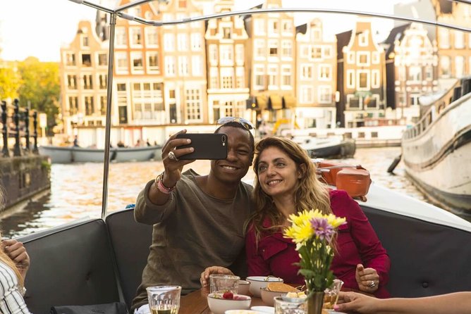 Private Romantic Canal Cruise Amsterdam with Bubbly and Snacks - Prosecco, Dutch snacks, and what the food really adds
