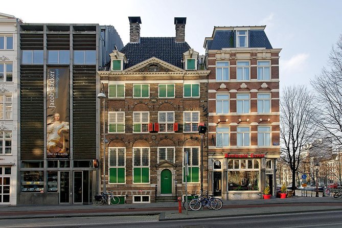 Rembrandt House & Neighborhood Exclusive Guided Walking Tour - Rembrandtplein and the Night Watch bronze: placing the famous painting