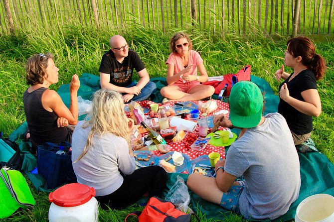 Small-Group Guided Sunset Canoe Tour in Waterland with Dinner - Canoe time through reed beds, meadows, and old Dutch waterways