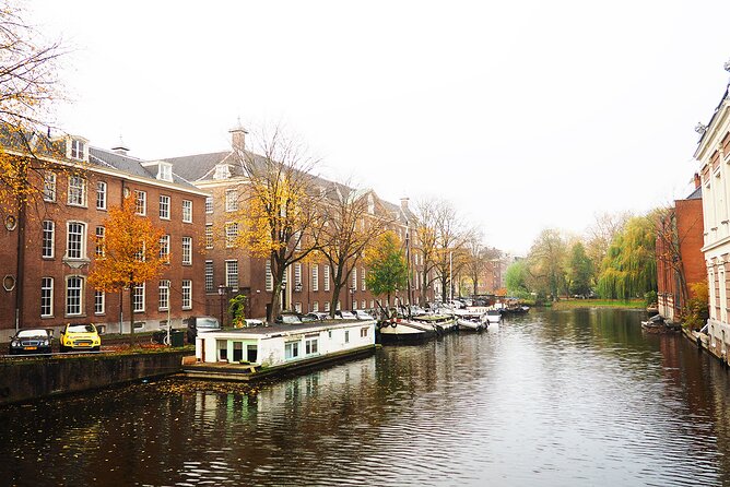 Small Group Hidden Gems Tour in Amsterdam - ARTIS Amsterdam Royal Zoo: flamingos, influential people, and WWII resistance