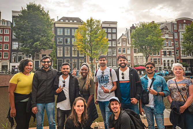 Small Group Walking Tour - Hello Amsterdam - Dam Square to Damrak: the city center, explained on the move